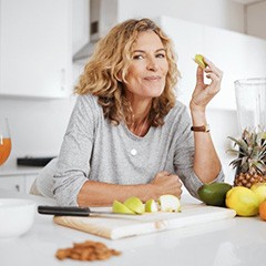 a woman enjoying healthy food at home