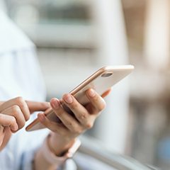 Closeup of patient looking at phone