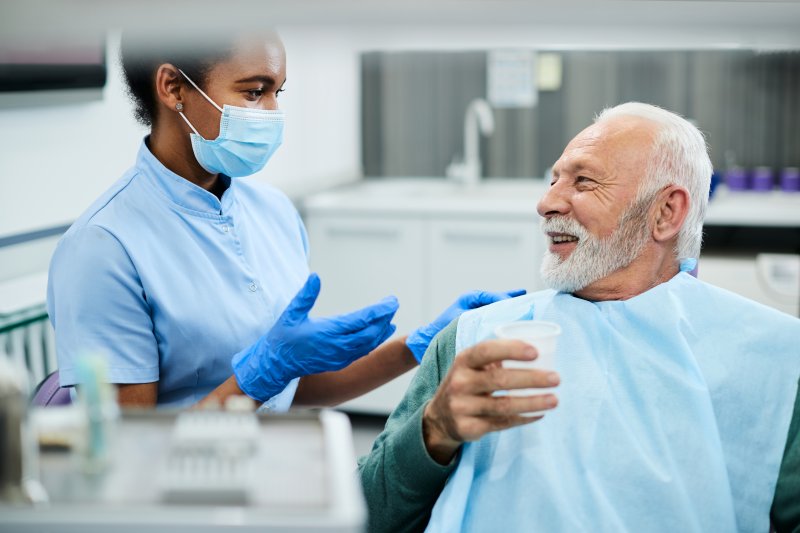 man discussing gum disease with his dentist