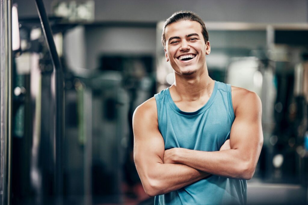 A man smiling at the gym