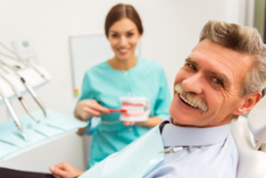 Patient smiling with his cosmetic dentist